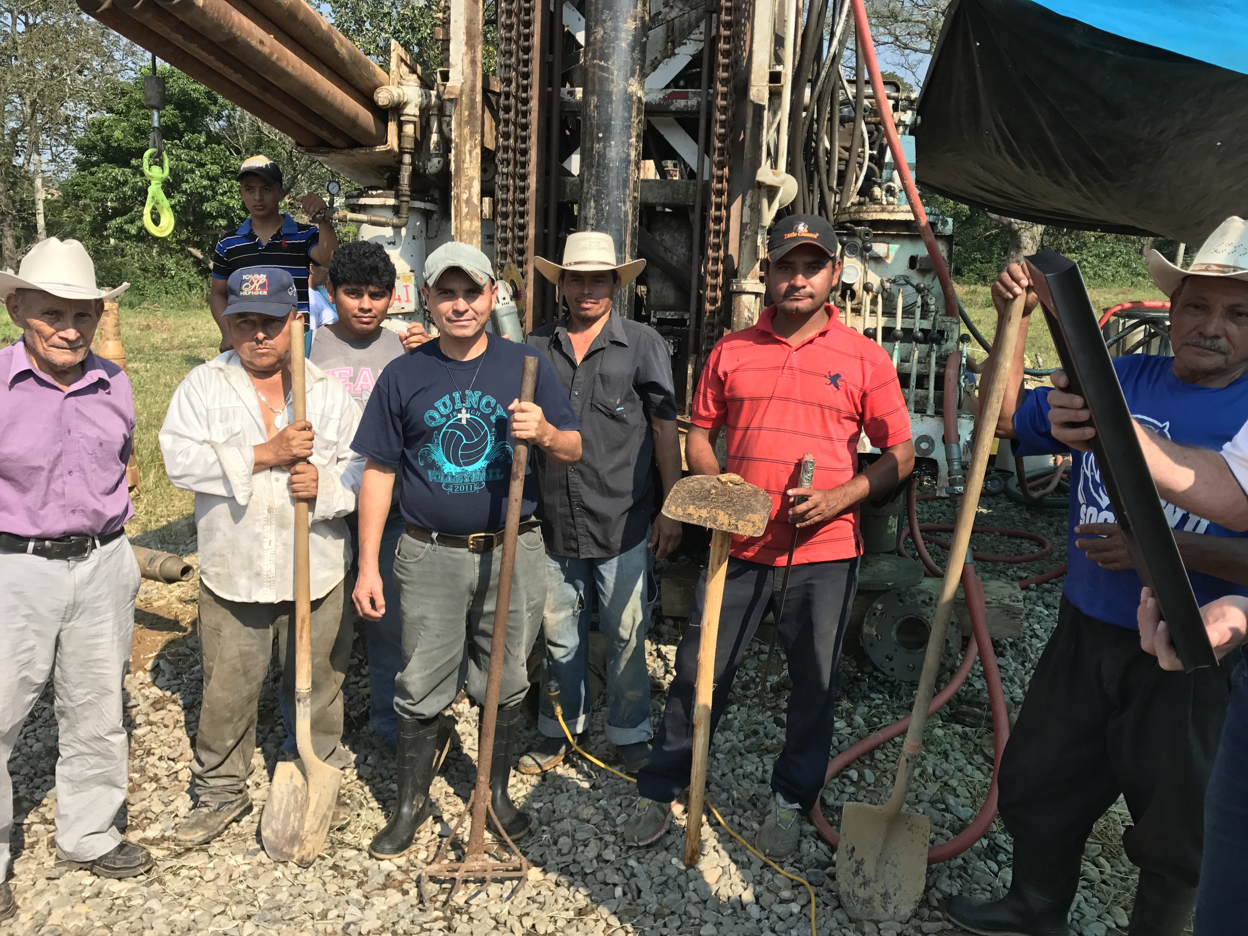 Residents from the community work along side the Mountain of Hope team to get water